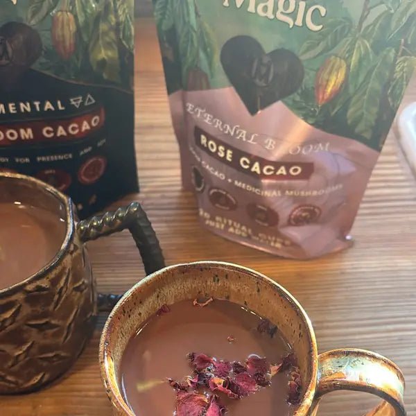 A mug topped with rose petals beside bags of Elemental and Eternal Bloom Rose, from Jeannie J.'s review