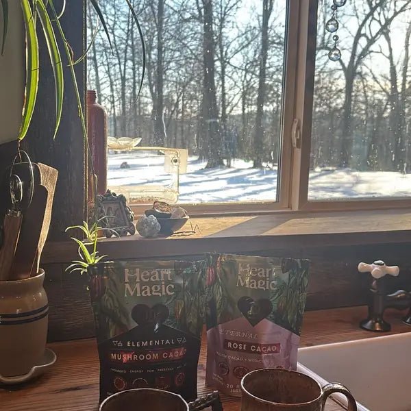 Two mugs and bags of Heart Magic on a snowy windowsill, from Jeannie J.'s review