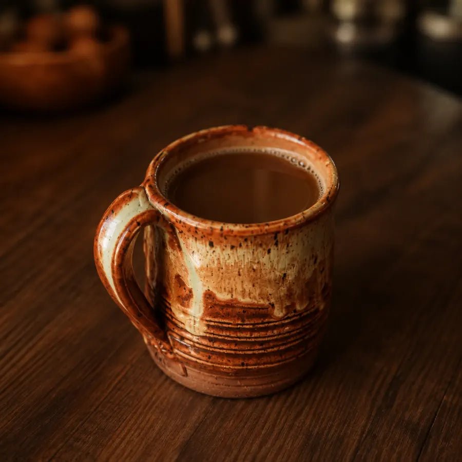 A mug of thin, brown mushroom coffee with no foam